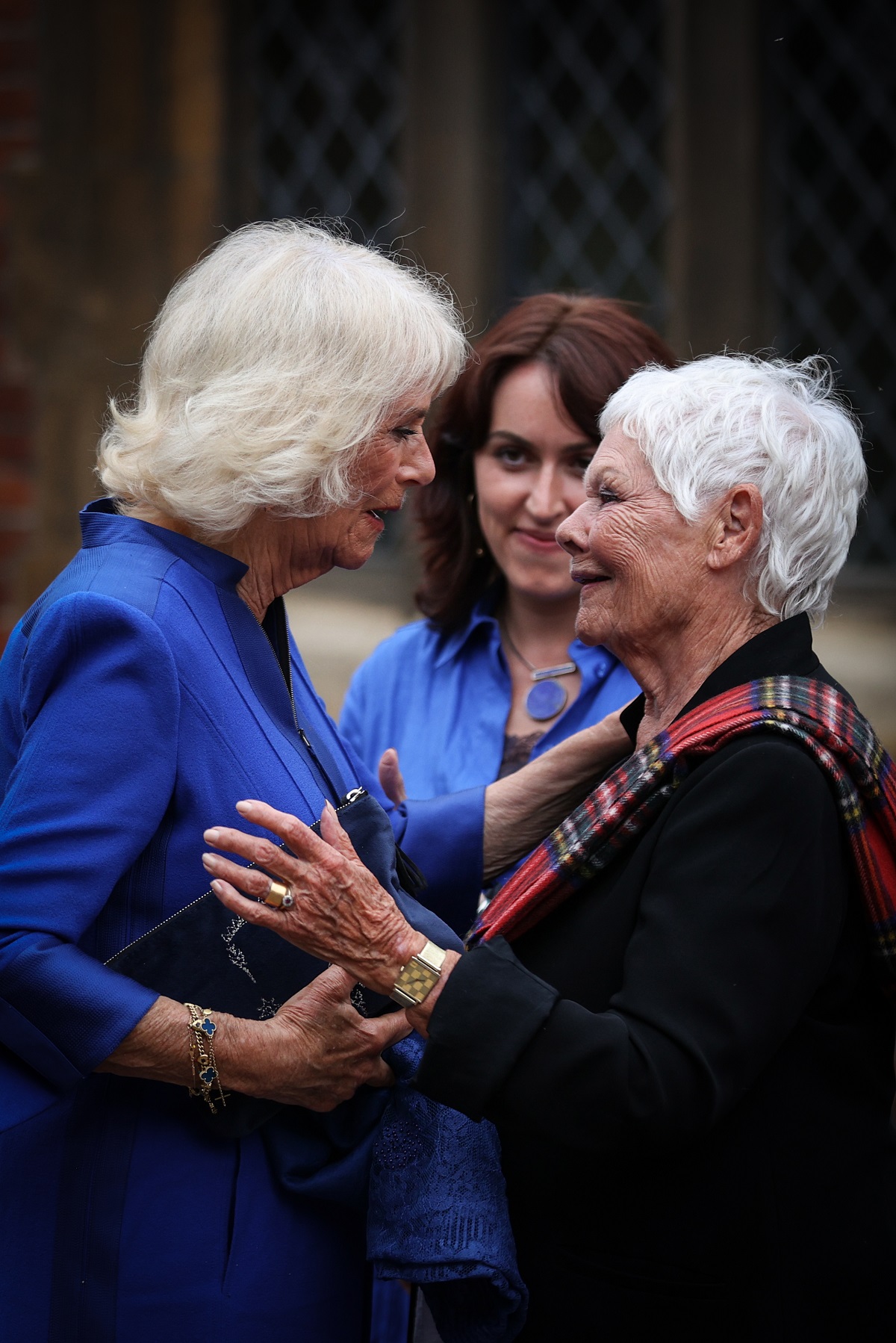 Camilla Parker Bowles greeting actor Judi Dench during a reception for the inaugural Queen's Reading Room Literary Festival