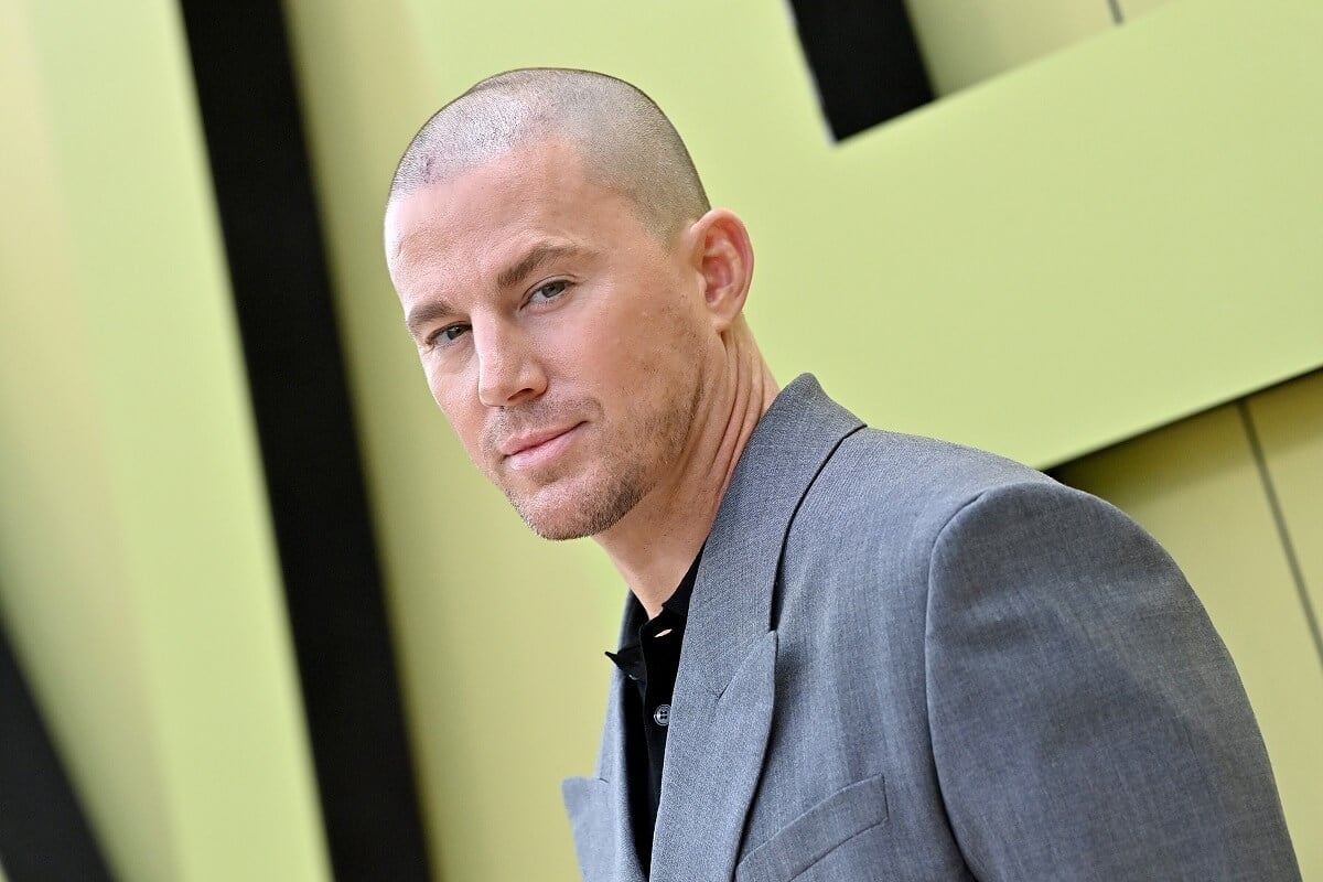 Channing Tatum posing in a suit at the the Versace FW23 Show.