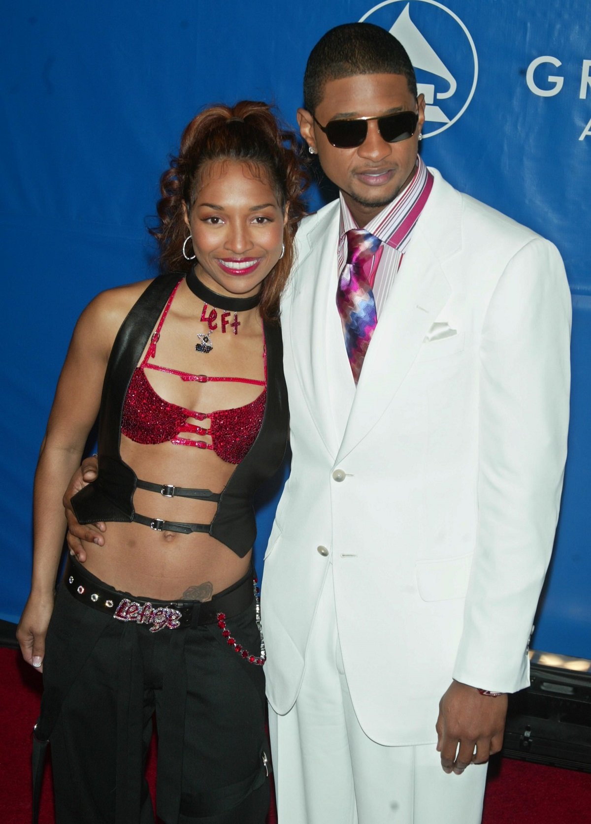 Chilli and Usher pose on the carpet together at the 45th annual GRAMMY Awards