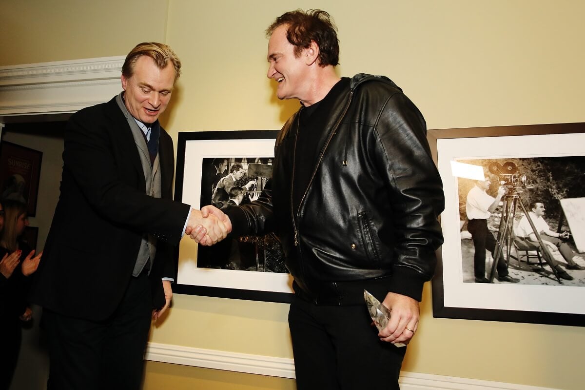 Christopher Nolan and Quentin Tarantino shaking hands at the Lifetime Achievement Awards.