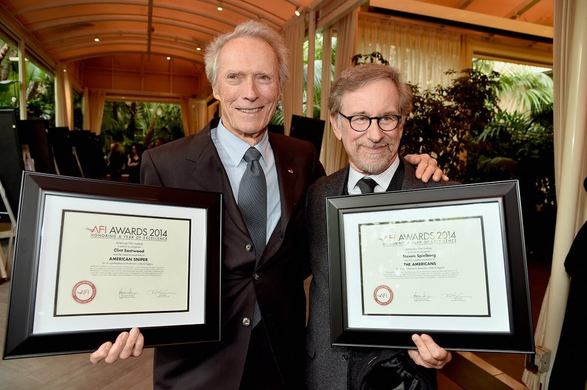 Clint Eastwood and Steven Spielberg posing with awards at the 15th Annual AFI Awards.