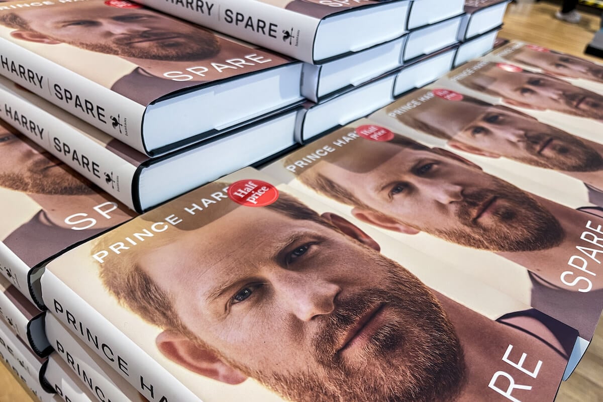 Copies of Prince Harry's book, 'Spare,' which reportedly have him and Meghan Markle in a 'win-win' situation