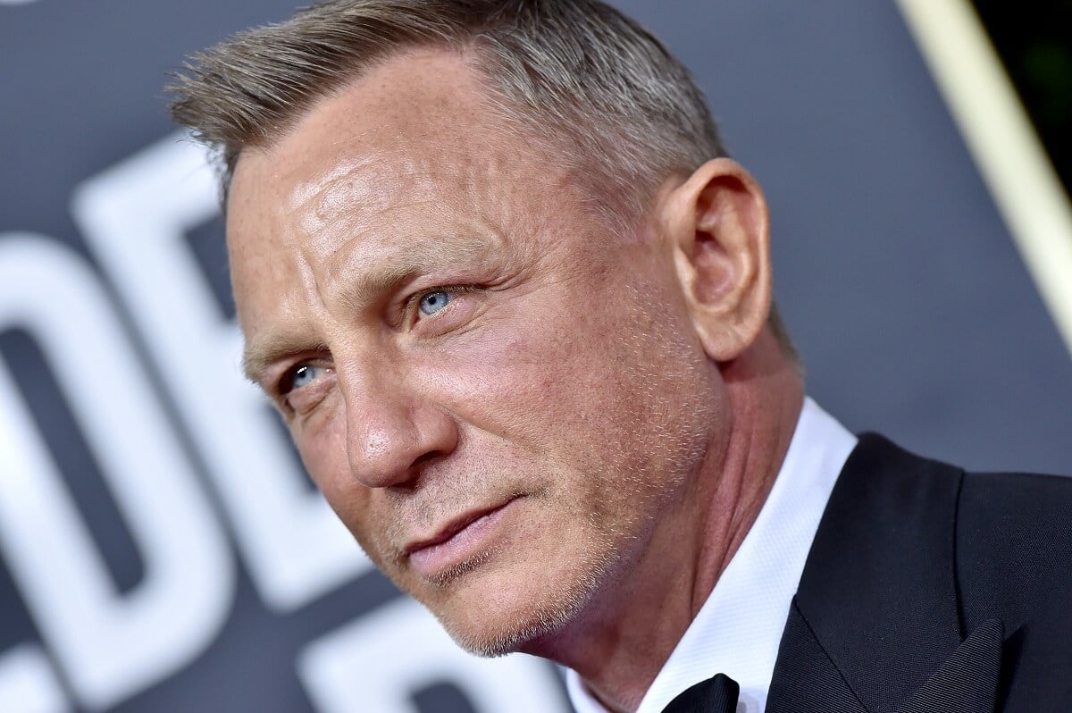 Daniel Craig posing in a suit at the 77th annual Golden Globes.