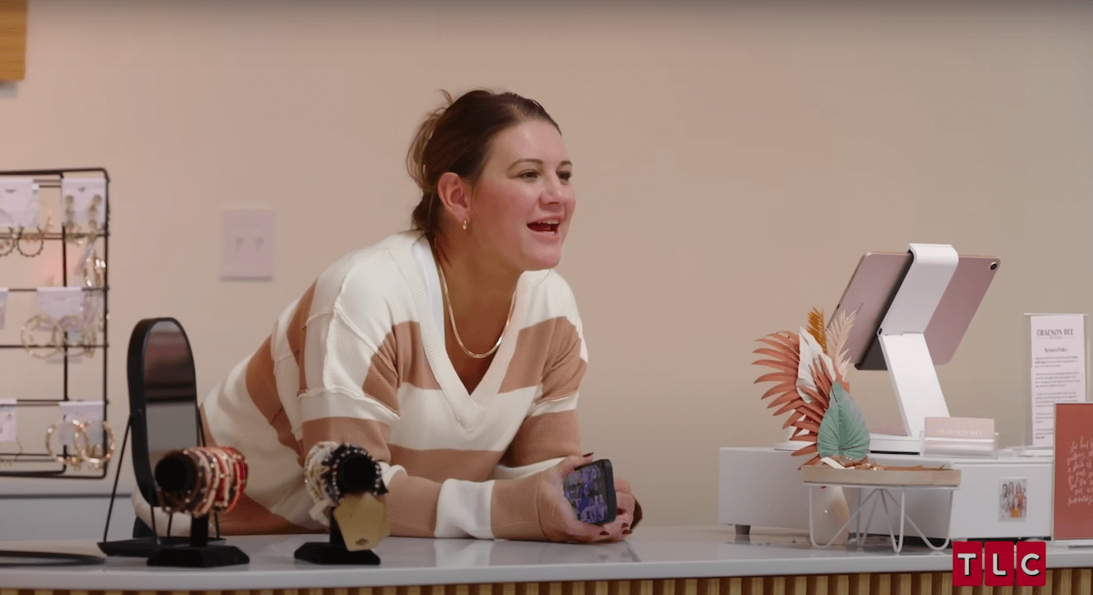 Danielle Busby leaning on a counter in a scene from 'Outdaughtered' Season 9