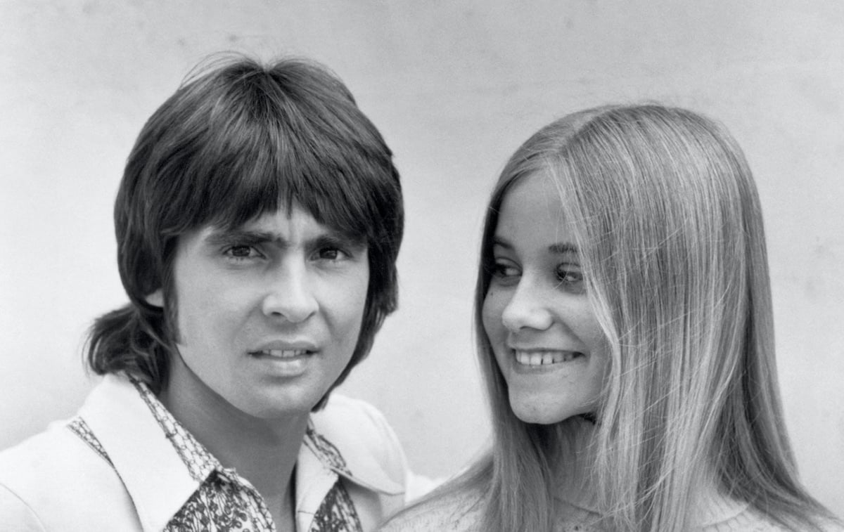 Black and white photo of Davy Jones and Maureen McCormick on 'The Brady Bunch'