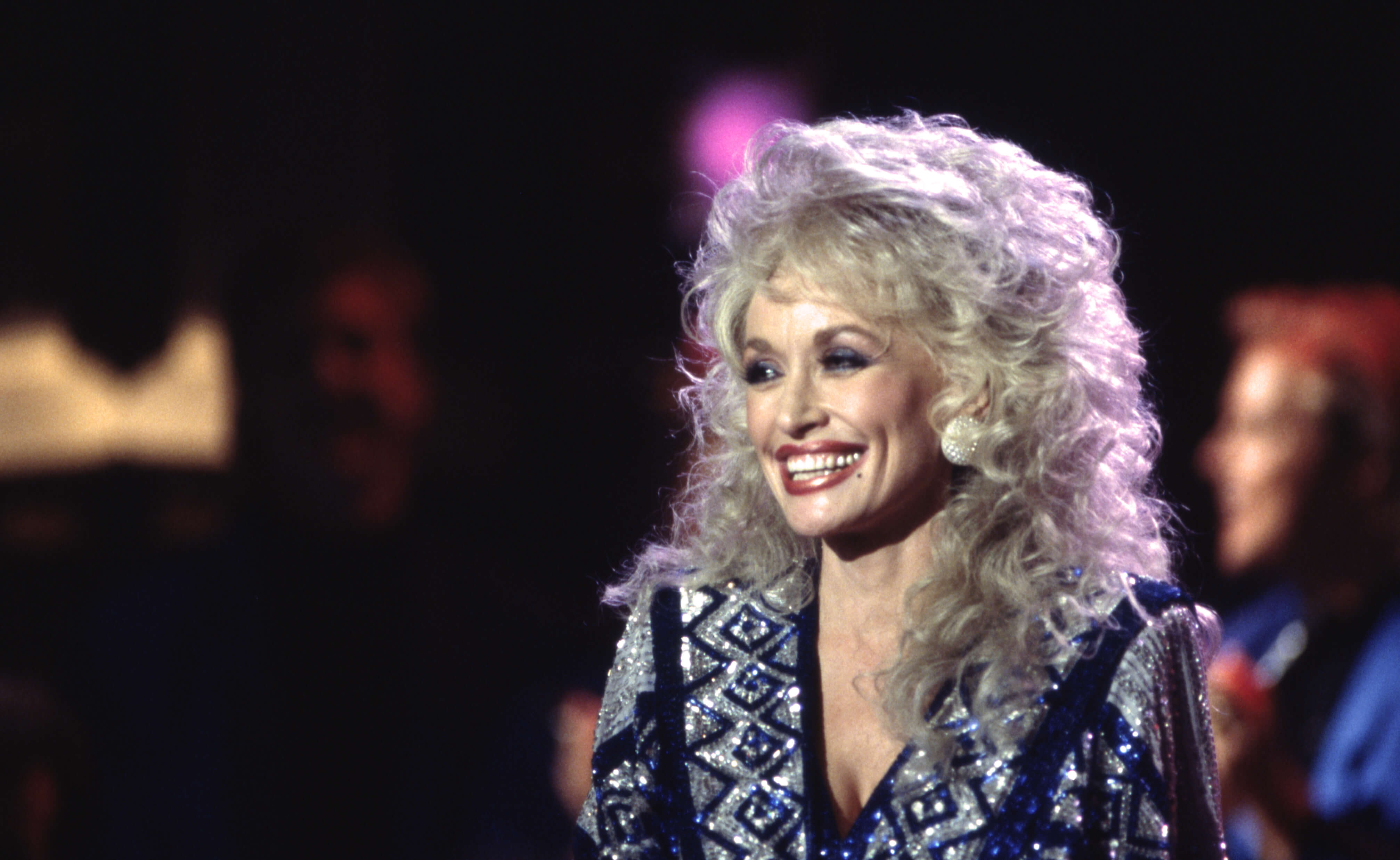 Dolly Parton in a black outfit.