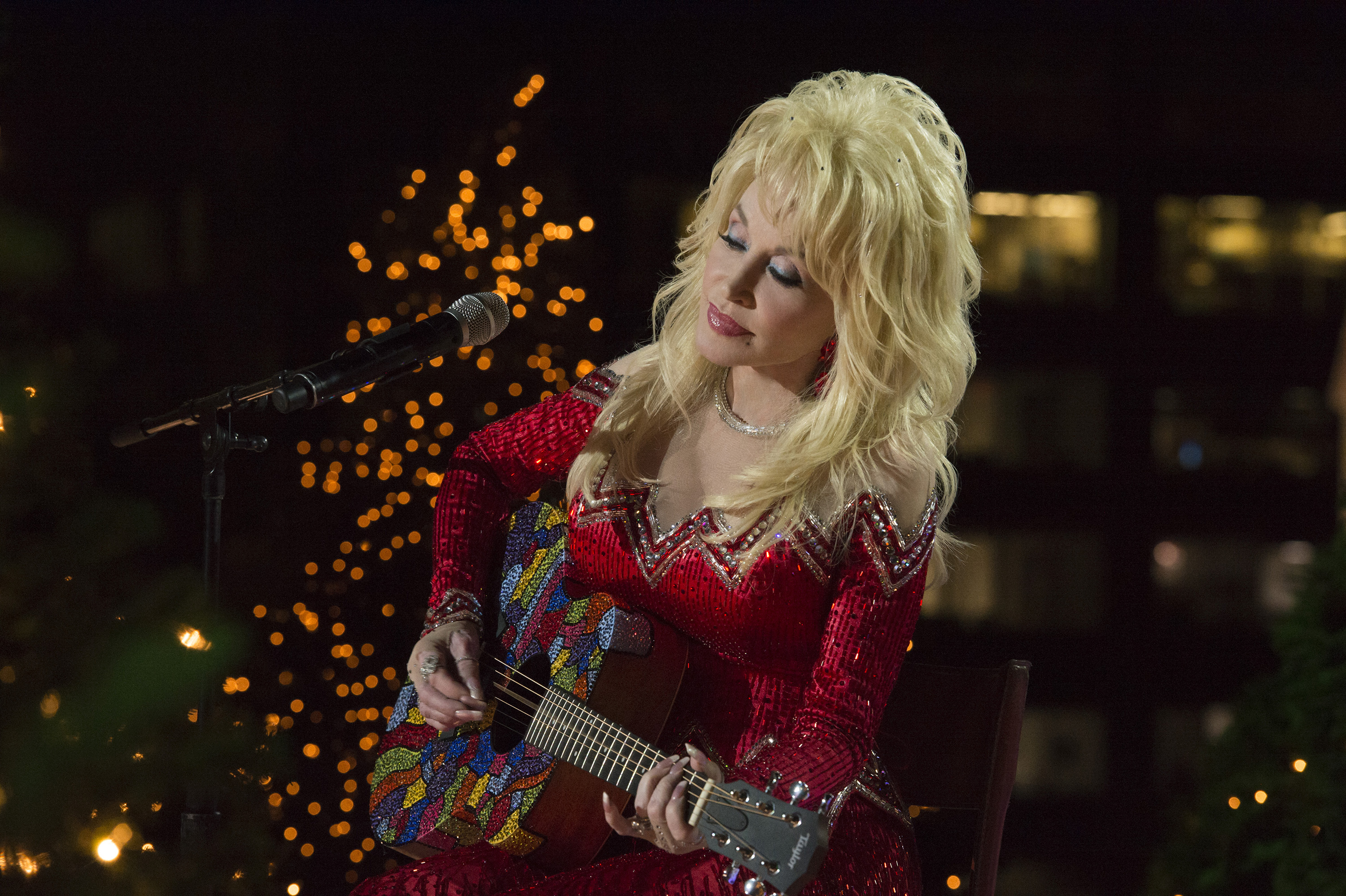 Dolly Parton playing guitar