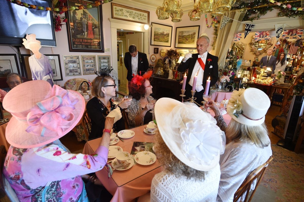 Edmund Fry leads guests in a toast to Prince Harry and Meghan Markle during an afternoon tea service at The Rose Tree Cottage in 2018