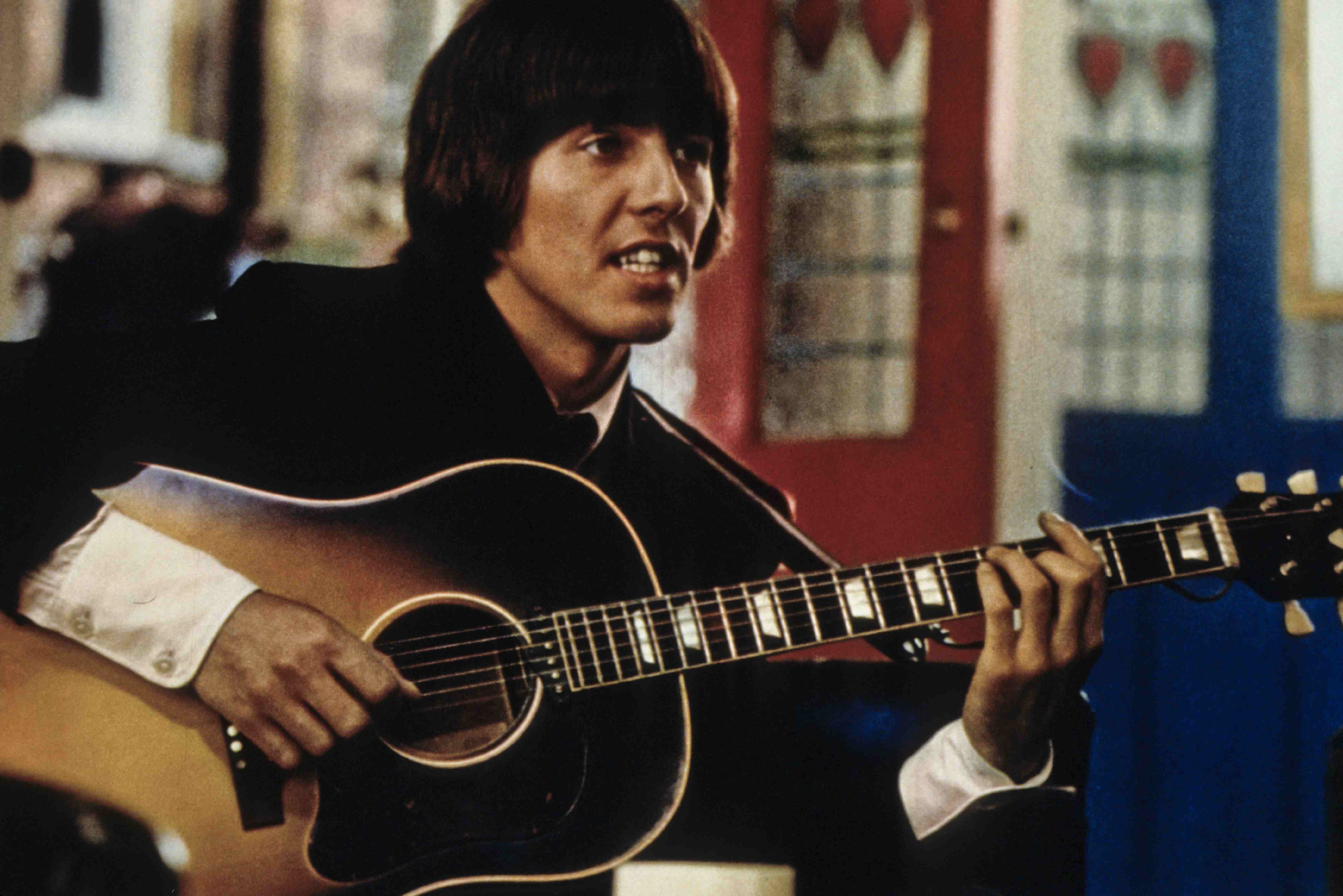 George Harrison playing guitar.