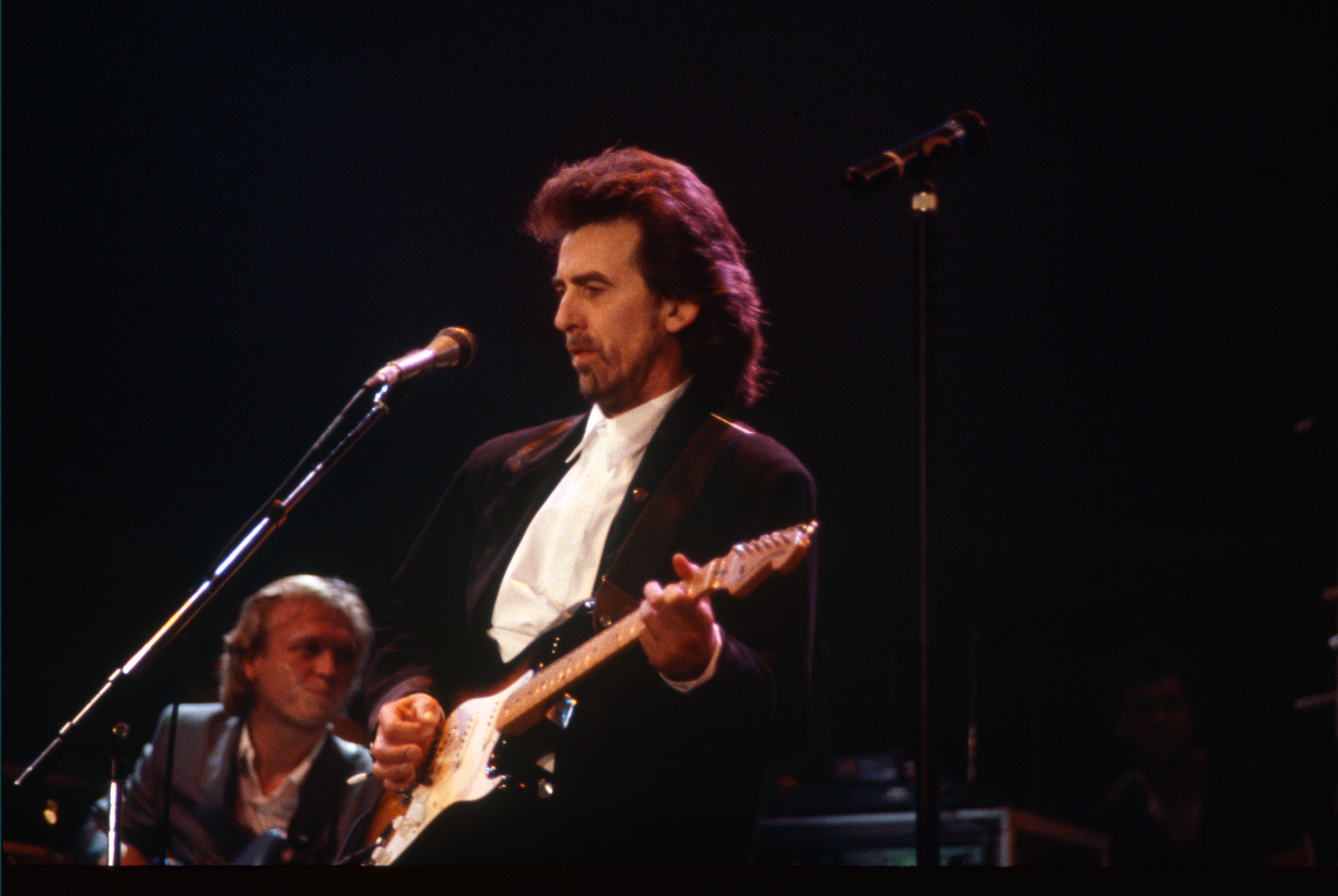 George Harrison performs at Wembley Arena in 1987