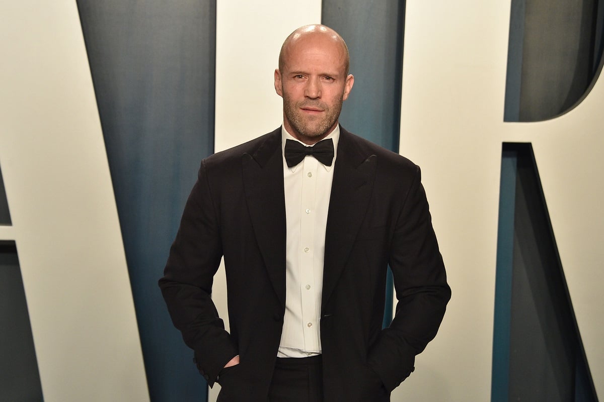 Jason Statham posing at the 2020 Vanity Fair Oscar Party.