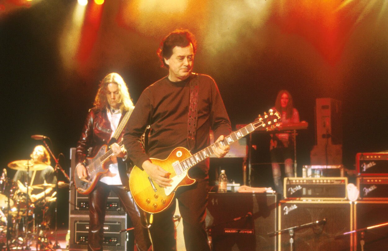 Led Zeppelin guitarist Jimmy Page (front) plays a Gibson Les Paul while performing with guitar player Rich Robinson and The Black Crowes.