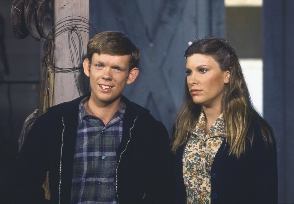 'The Waltons' cast members Jon Walmsley and Judy Norton standing next to each other