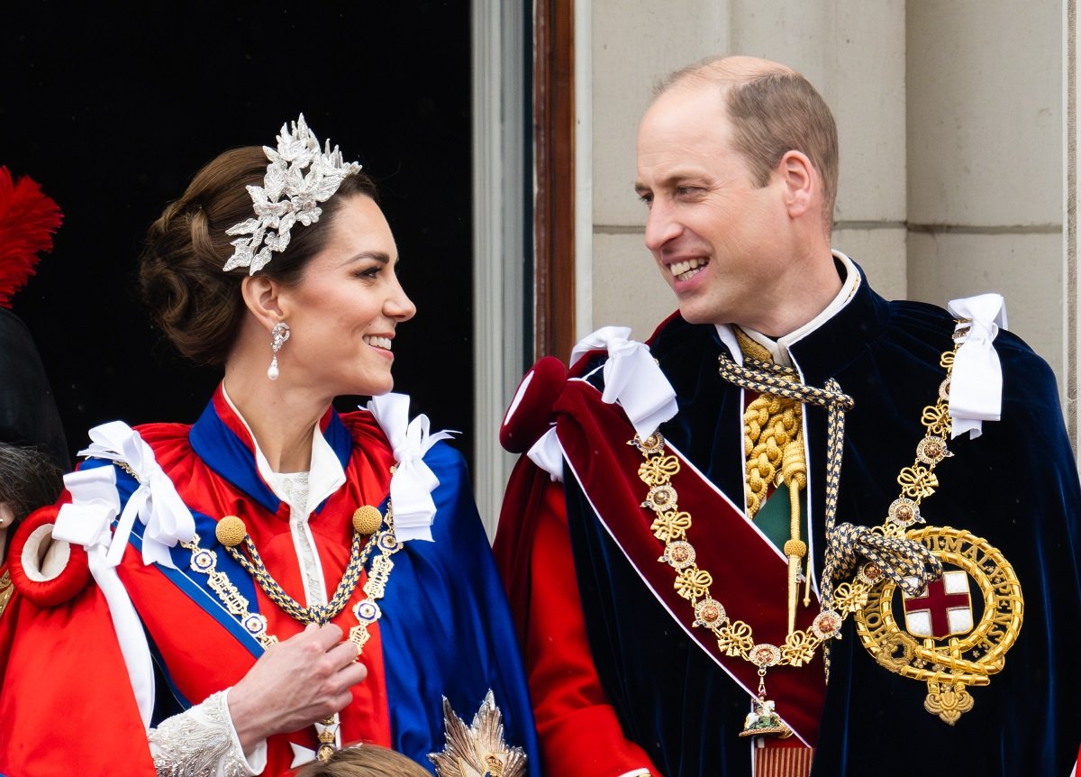 Kate Middleton and Prince William standing on the Buckingham Palace balcony during the Coronation of King Charles III