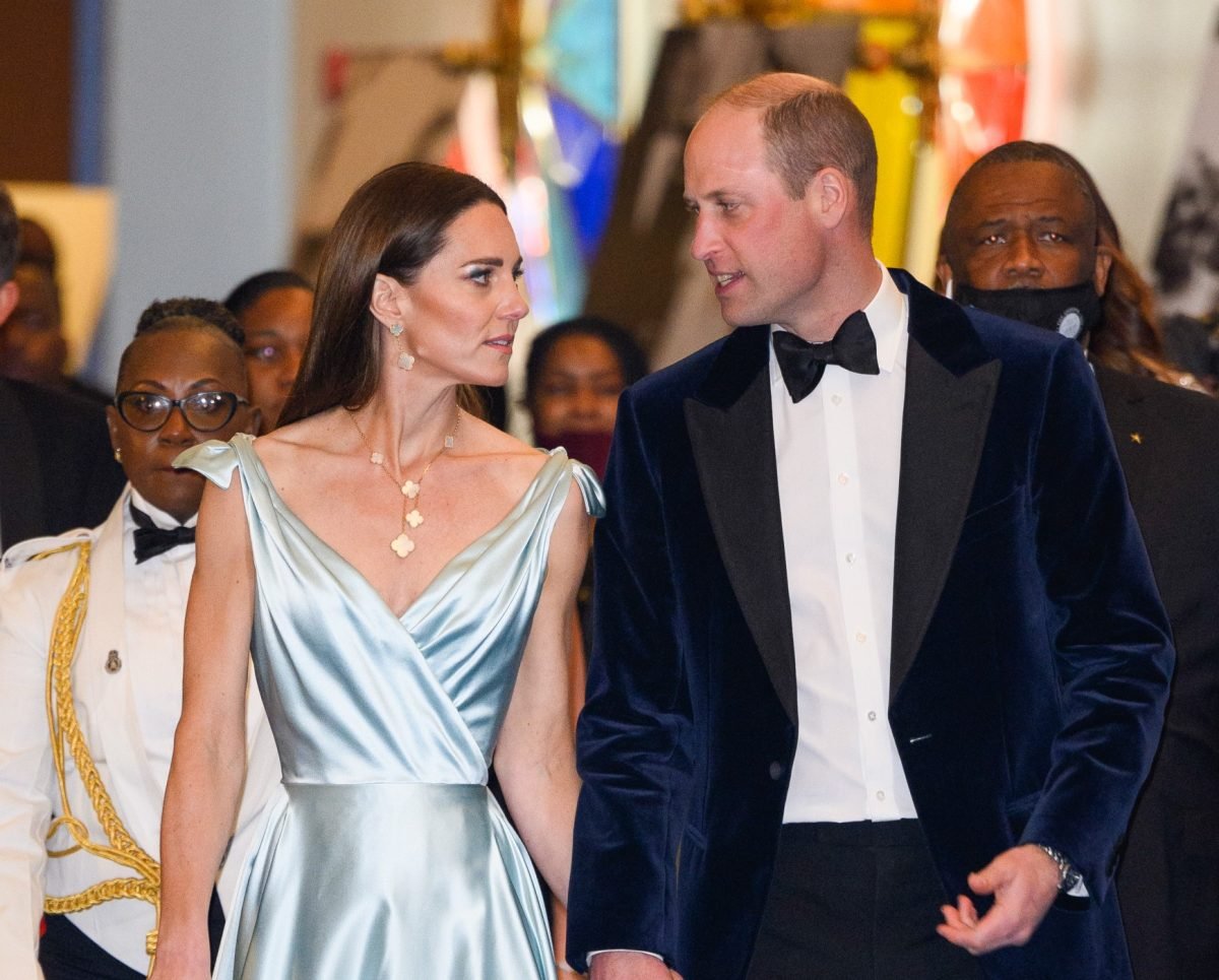 Kate Middleton and Prince William, whose body language at the Jordan royal wedding was analyzed, attend a reception in Nassau, Bahamas