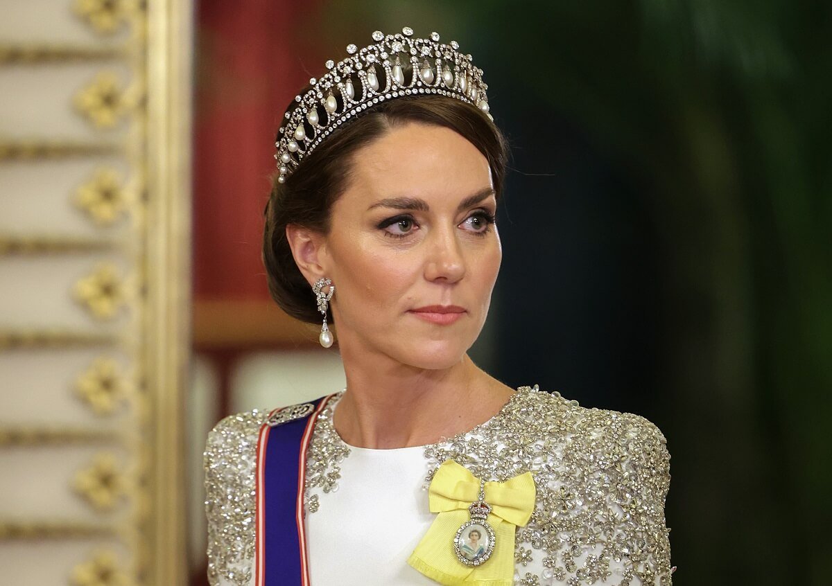Kate Middleton donning Queen Mary's Lover's Knot tiara, which can sometimes cause problems for those wearing it, to a State Banquet at Buckingham Palace