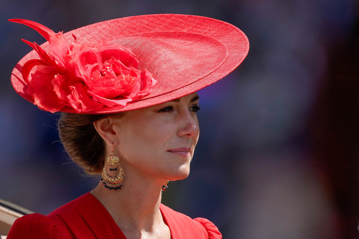 Kate Middleton, who channeled Queen Elizabeth II at the 2023 Royal Ascot, looks on wearing red