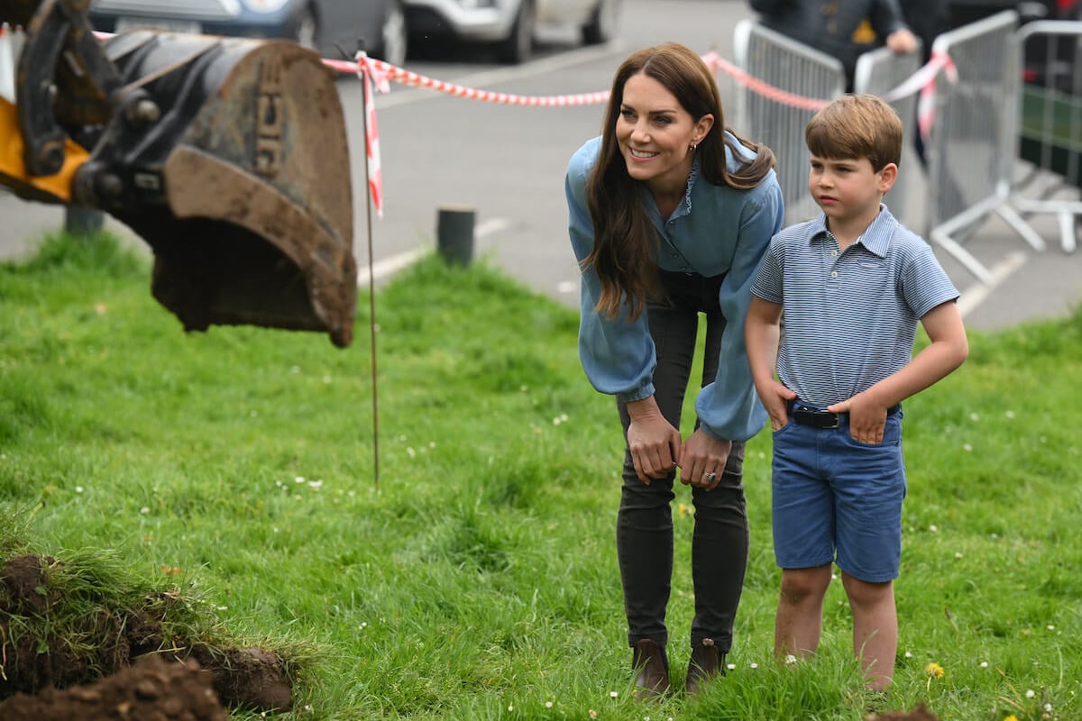 Kate Middleton, who reminds Prince Louis to 'stay calm' with one move, according to a body language expert, stands next to Prince Louis