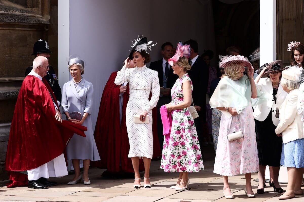 Kate Middleton, whose 2023 Order of the Garter polka dot dress has been dubbed 'redundant,' stands with Sophie, Duchess of Edinburgh