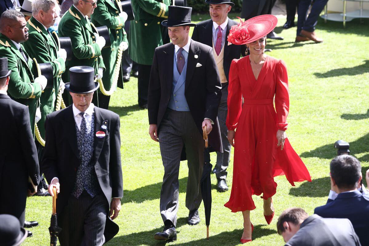 Kate Middleton, whose clothes went from 'bussinesslike' to 'feminine' in 2023, walks with Prince William