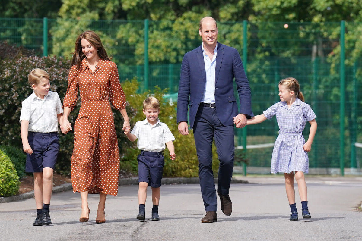 Kate Middleton, whose 'unhappy' school experience has influenced Prince George, Prince Charlotte, and Prince Louis' education, walks with Prince William and their children at Lambrook School