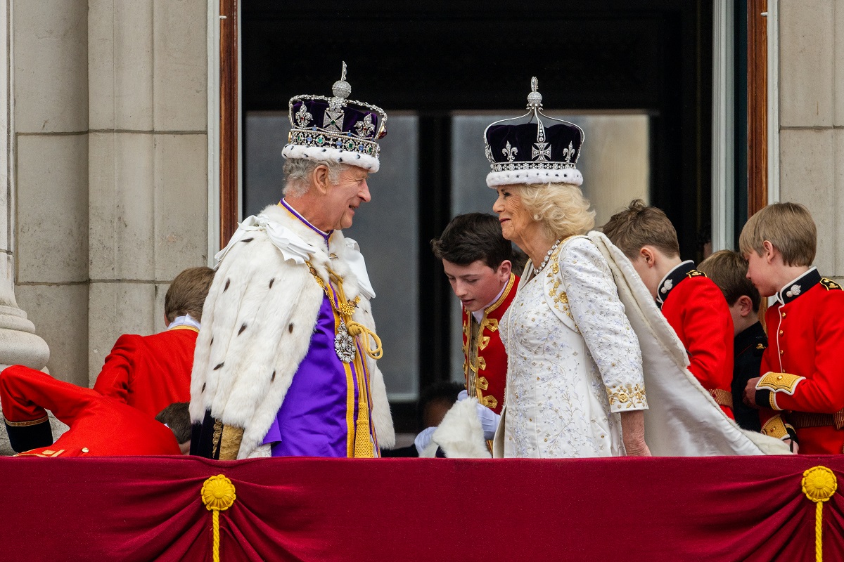 King Charles III and Queen Camilla stand on the Buckingham Palace balcony during the Coronation