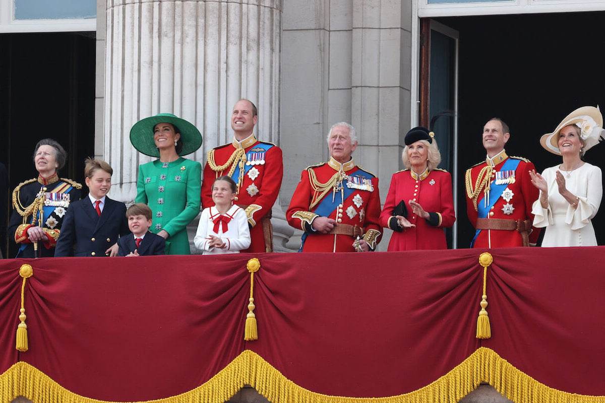 King Charles, who apologized to Princess Charlotte at Trooping the Colour, according to a iip reader, stands on the Buckingham Palace balcony with British royals