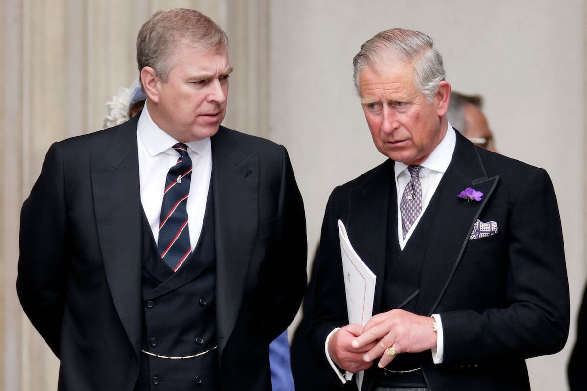 King Charles, who reportedly can't do much to get Prince Andrew to move out of the Royal Lodge, stands next to his brother