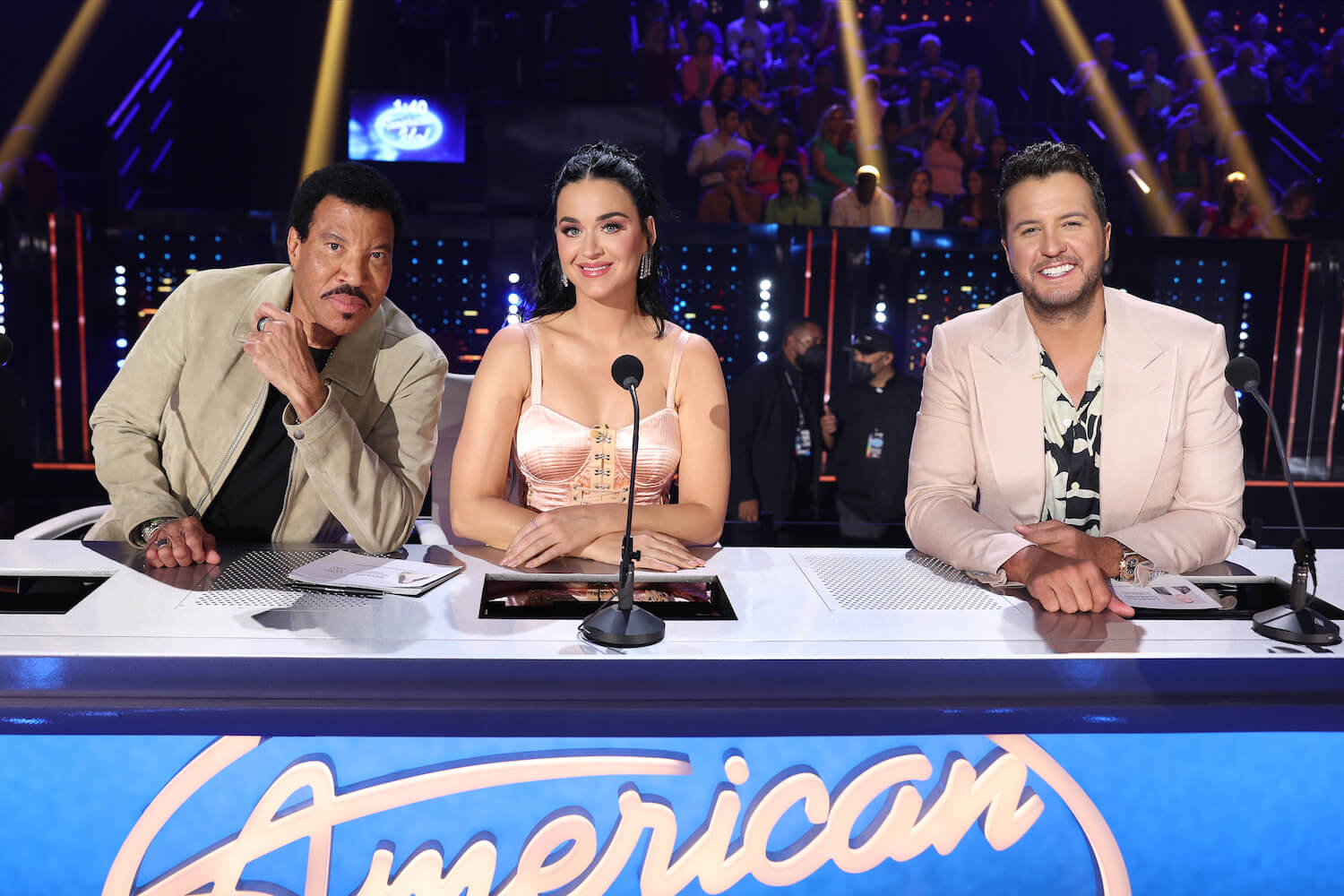 Lionel Richie, Katy Perry, and Luke Bryan on 'American Idol' sitting behind the judges' table