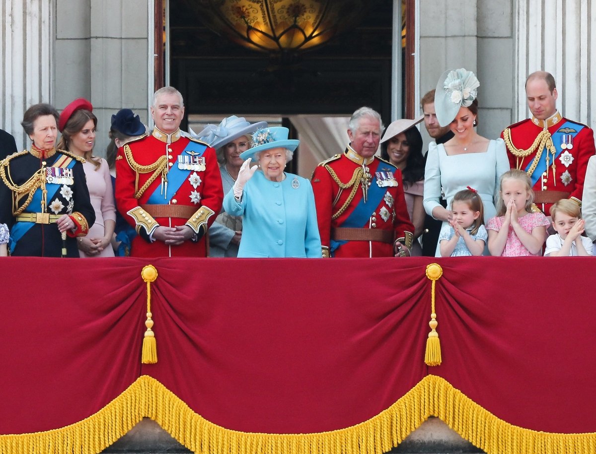 Members of the royal family including Princess Anne, who a body language expert says has the same walk and mannerisms as Queen Elizabeth II, standing on the balcony of Buckingham Palace