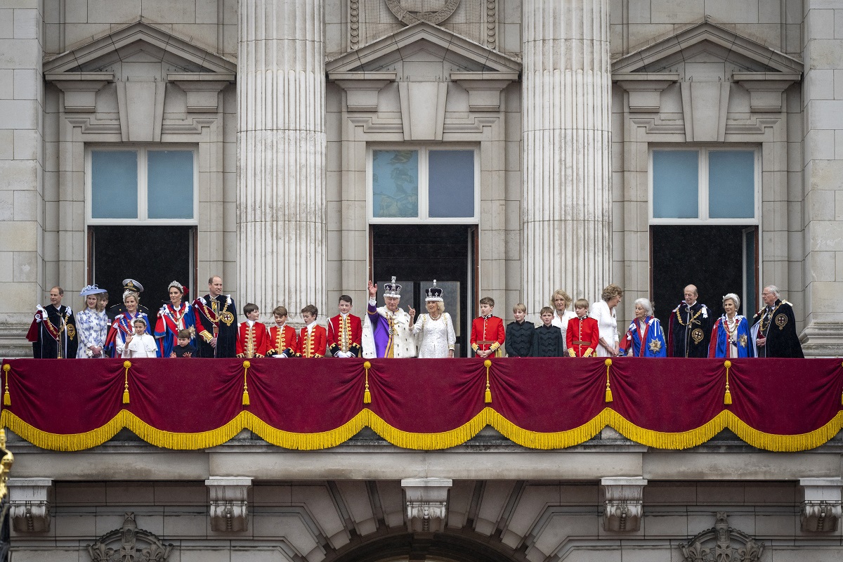 Members of the royal family standing on the Buckingham Palace balcony after the coronation ceremony of King Charles III