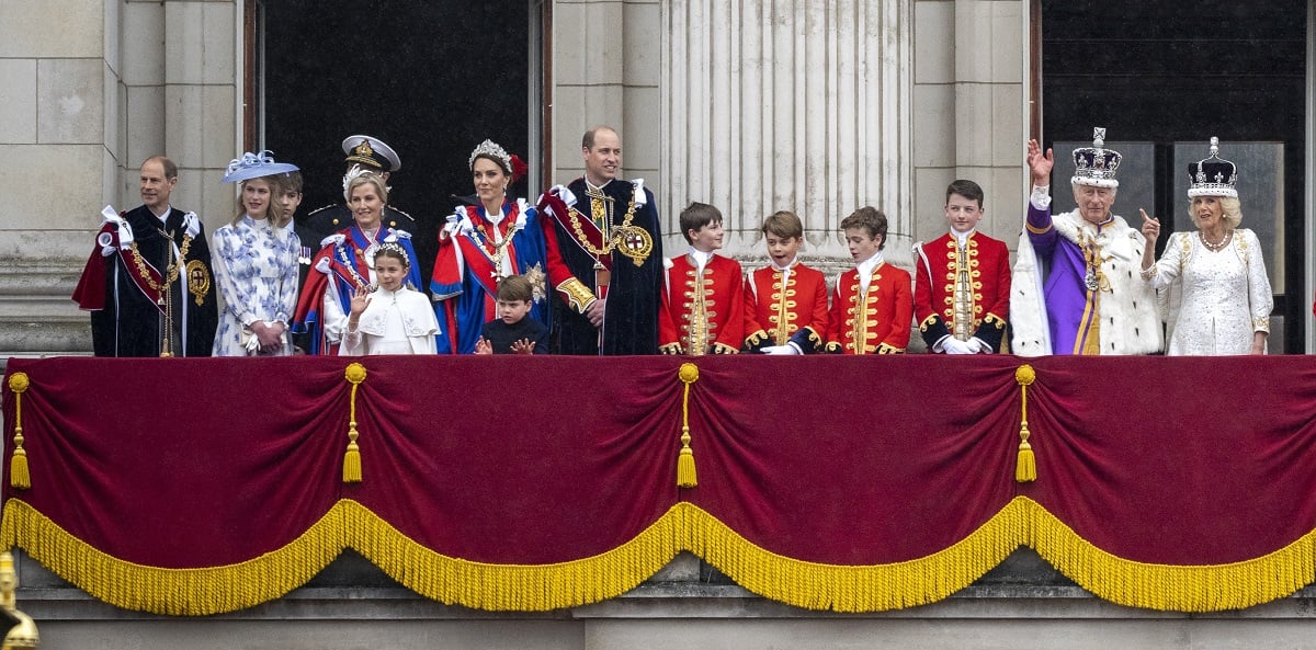 Members of the royal family standing on the Buckingham Palace balcony following King Charles's coronation ceremony