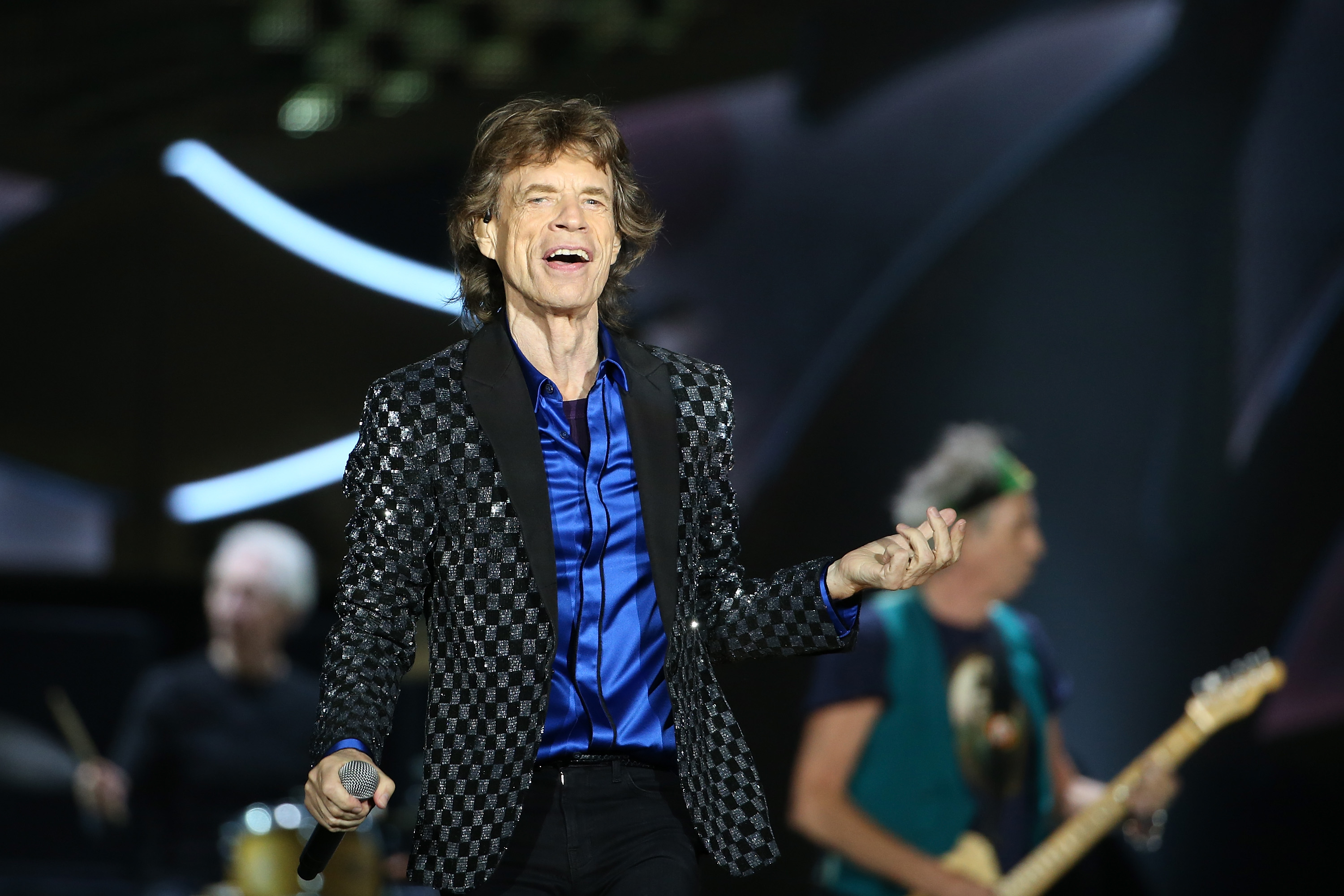 Mick Jagger performs on stage.