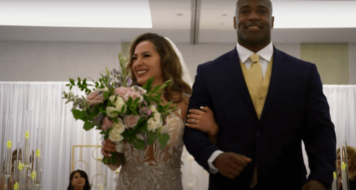 Myrla and Gil from 'Married at First Sight' Season 13 walking down the aisle on their wedding day