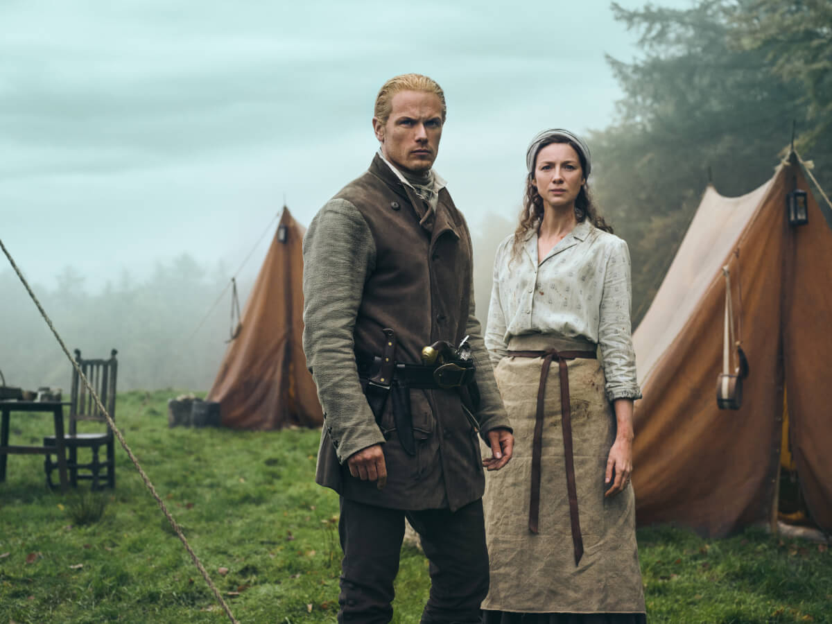 Outlander stars Sam Heughan (Jamie Fraser) and Caitriona Balfe (Claire Fraser) in an image from season 7