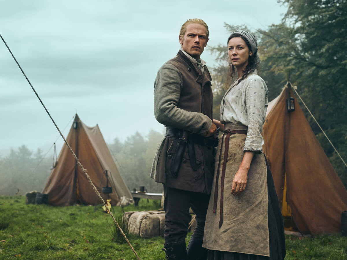 Outlander stars Sam Heughan (Jamie Fraser) and Caitriona Balfe (Claire Fraser) in an image from season 7