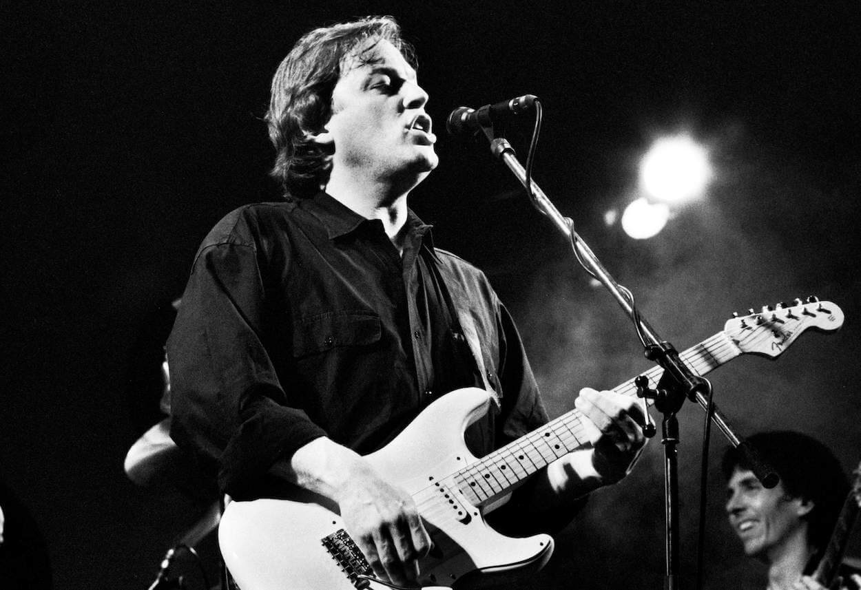 Pink Floyd guitarist David Gilmour playing a Fender Stratocaster during a live performance in 1984.