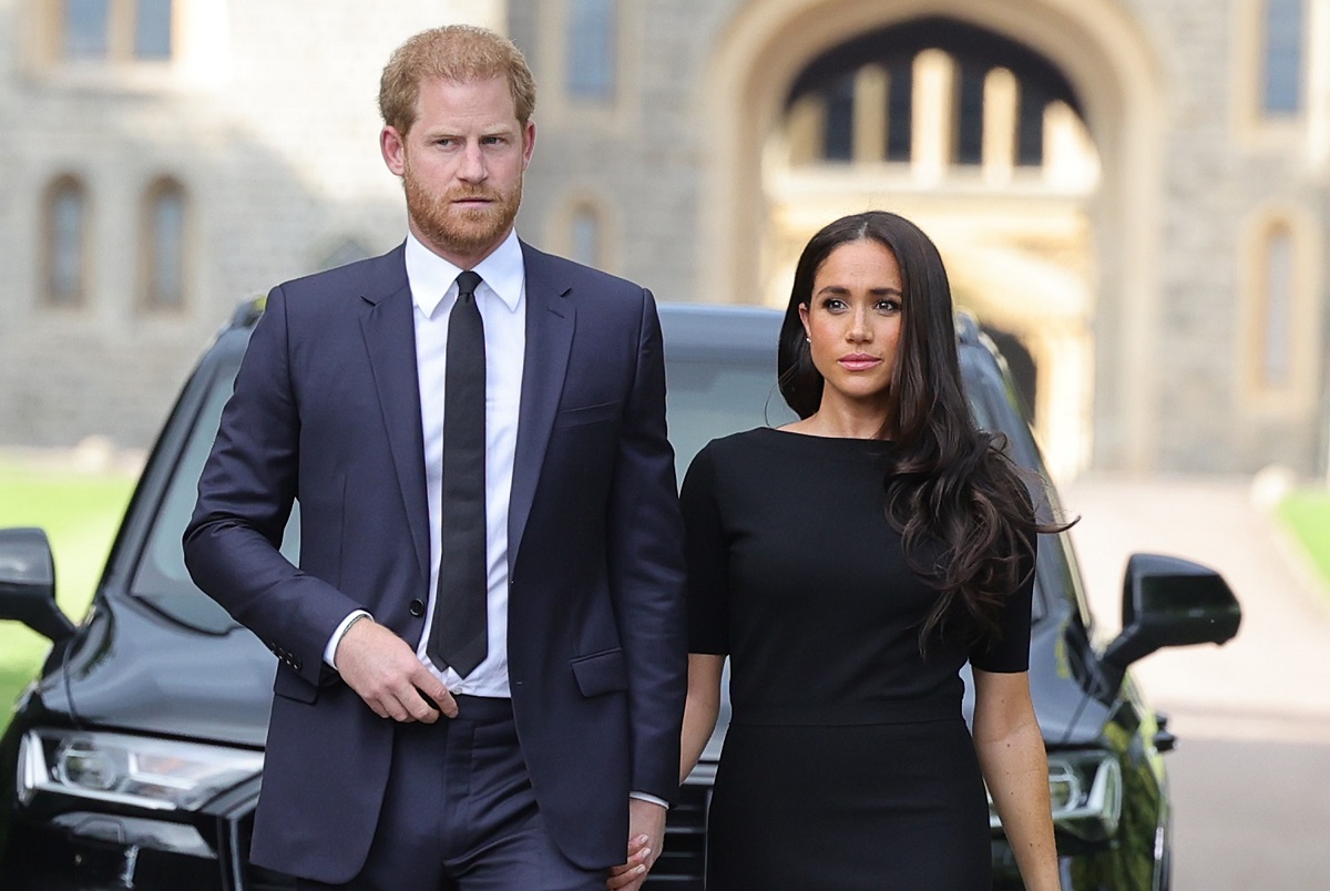 Prince Harry and Meghan Markle arrive on the long Walk at Windsor Castle to view flowers and tributes to Queen Elizabeth