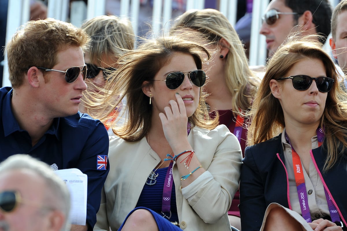 Prince Harry with Princess Eugenie (center) and Princess Beatrice in 2012