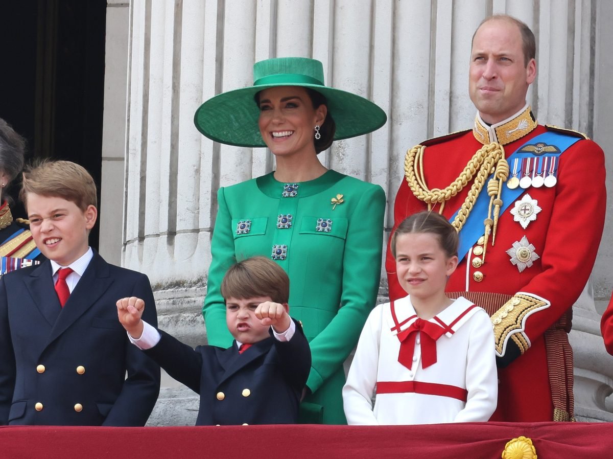 Prince William, Kate Middleton and their children standing on the balcony of Buckingham Palace to watch a fly past during Trooping the Colour