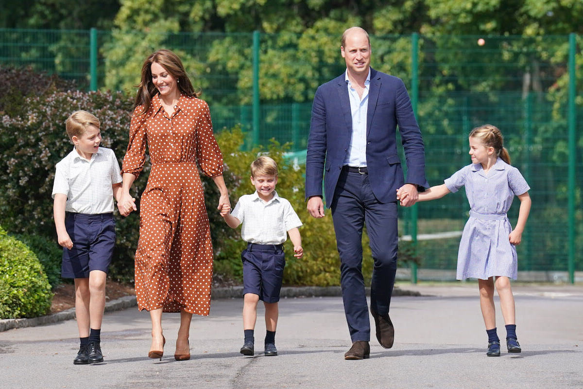 Prince William and Kate Middleton, who are said to have 'extremely busy' future royal tours because of their children, walk hand-in-hand with Prince George, Prince Louis, and Princess Charlotte
