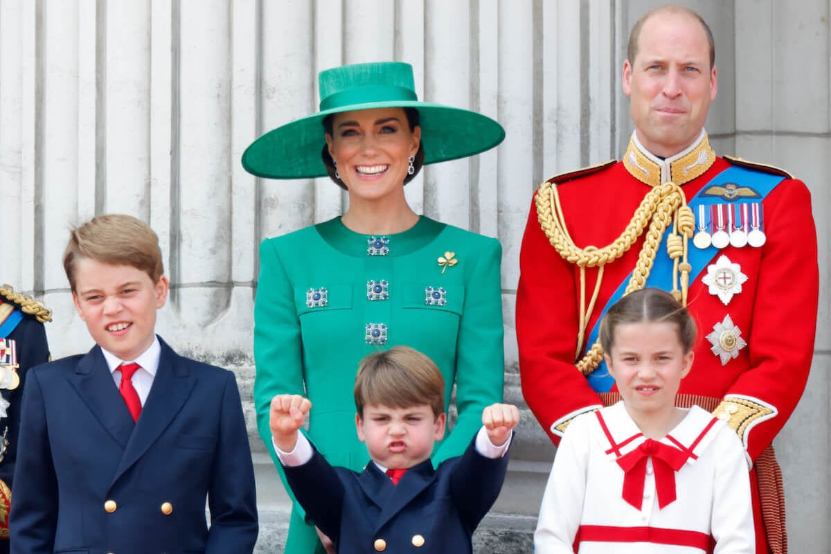 Prince William and Kate Middleton, who weren't in a 'hurry to curb' Prince Louis's enthusiasm at Trooping the Colour, stand with their children on the Buckingham Palace balcony
