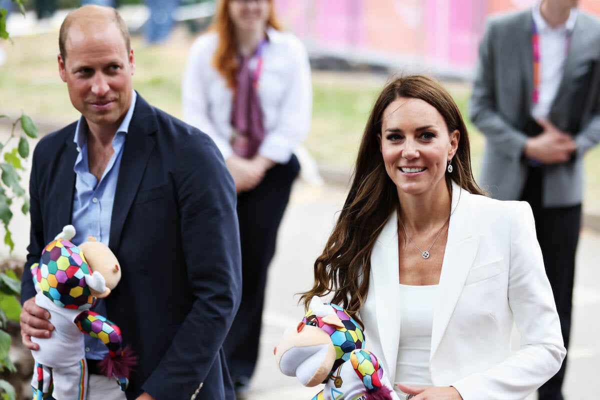 Prince William and Kate Middleton, whose subtle public displays of affection, or PDA, 'bulletproofs the royal body language, per an expert, stand next to each other