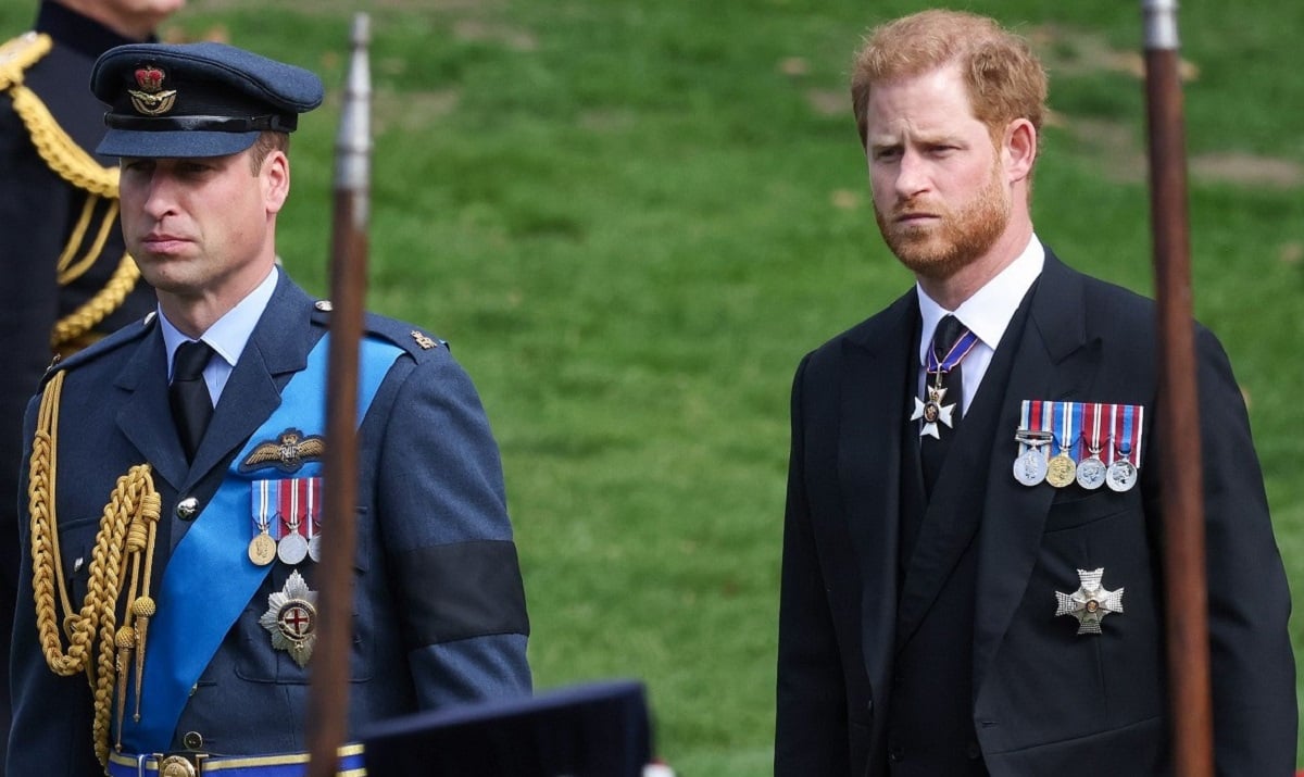 Prince William and Prince Harry, who a psychic predicts will reconcile and settle their feud, watch as the coffin carrying Queen Elizabeth II is transferred to a hearse
