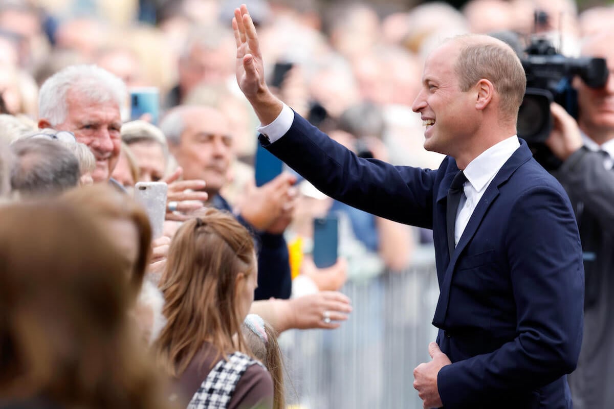 Prince William, who is a 'completely different person' based on his body language, waves