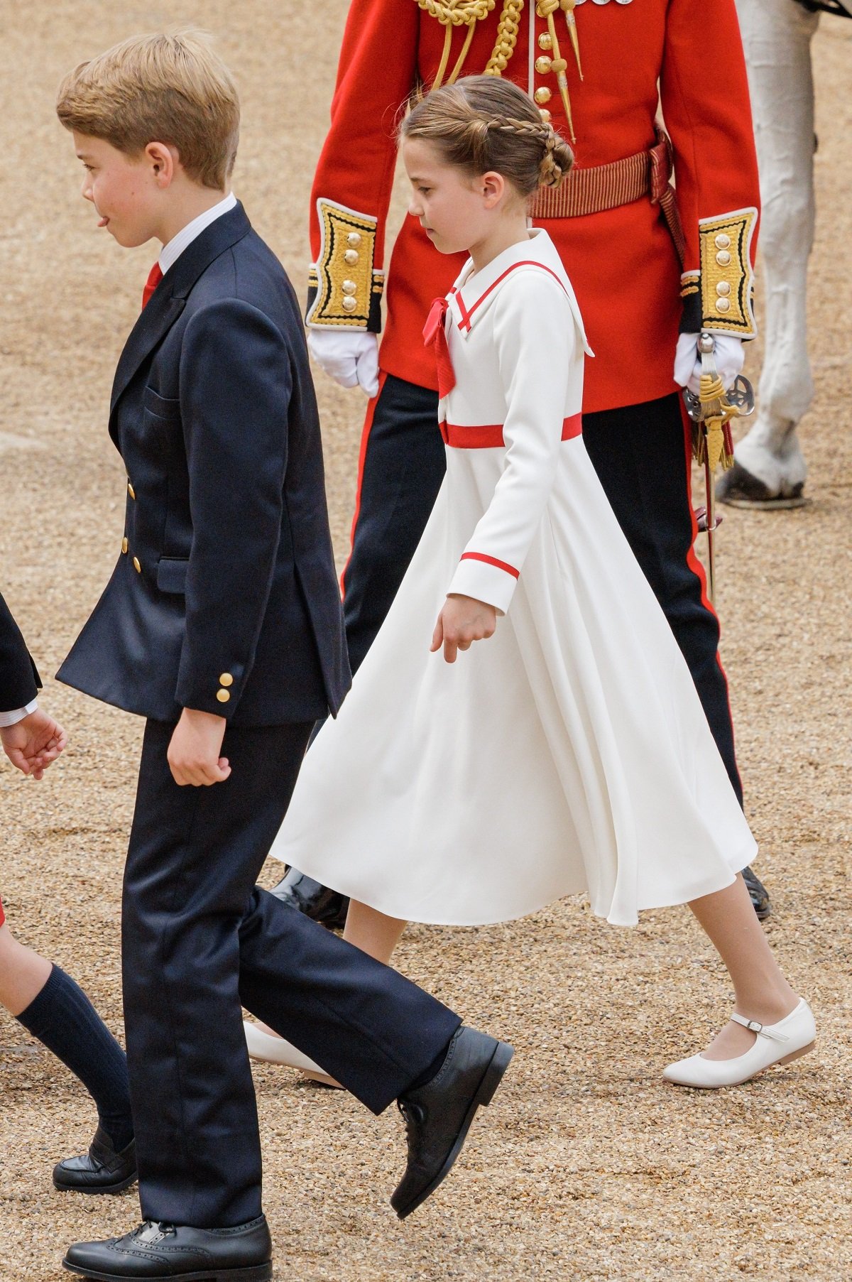 Princess Charlotte walking with Prince George from carriage during 2023 Trooping the Colour