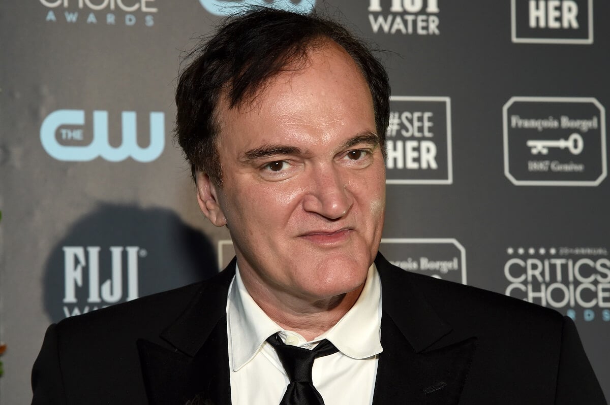 Quentin Tarantino posing in a suit at the Critics' Choice Awards.