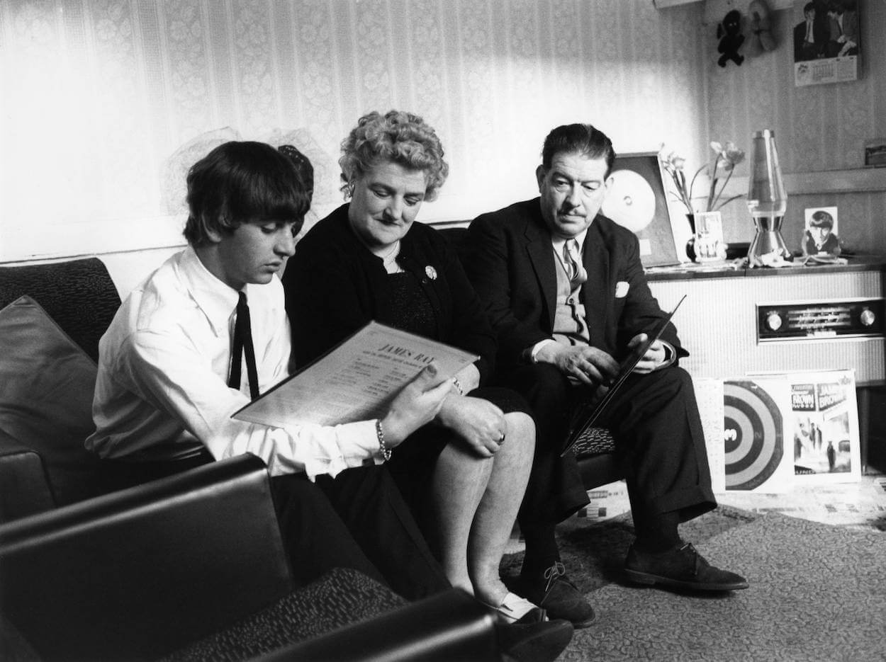 Beatles drummer Ringo Starr (left) sitting next to his mother, Elsie, and stepfather, Harry Graves, circa 1964.