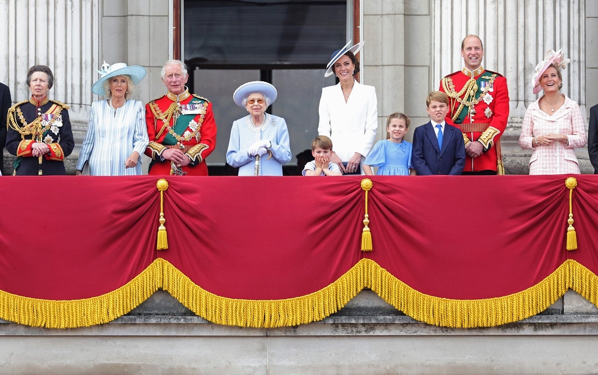 Several members of the royal family, including the late Queen Elizabeth II who is still the most popular royal after King Charles' coronation, standing on the balcony of Buckingham Palace