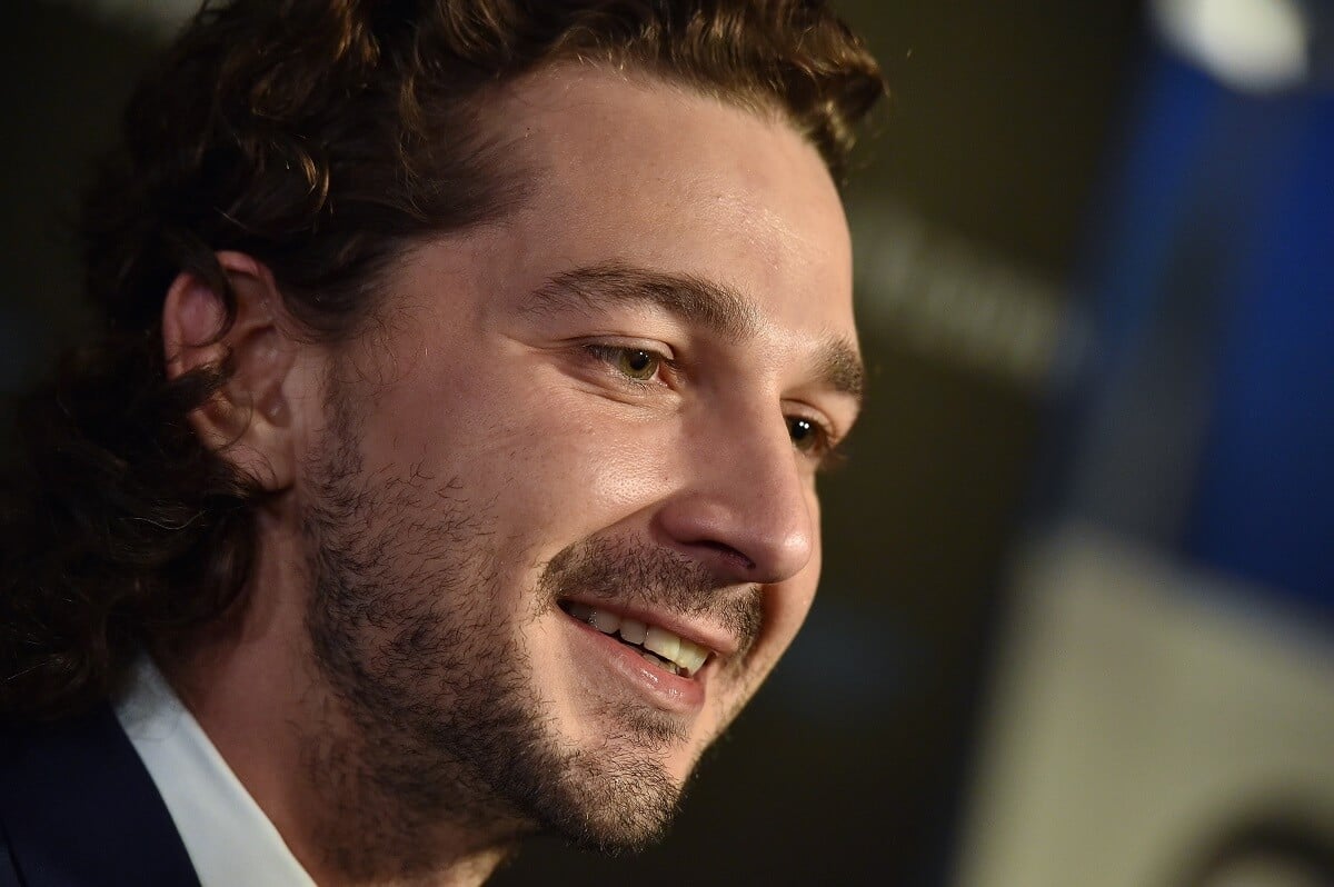 Shia LaBeouf smiling at the premiere of the premiere of the movie 'Man Down'.